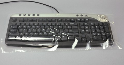 一次性透明键盘盖，带轻型胶粘剂背衬12 ' X 14 '。清晰,穿孔。